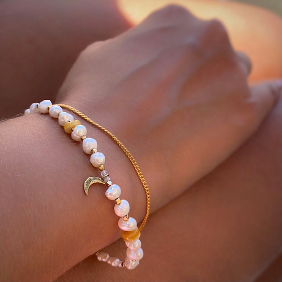 Pearl bracelet with gold chain and crescent moon charm