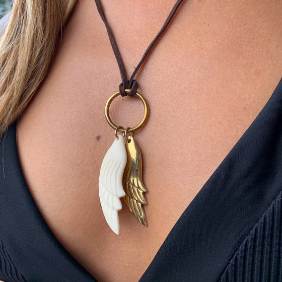 Brass angel wing pendant and carved angel wing charm on leather Necklace