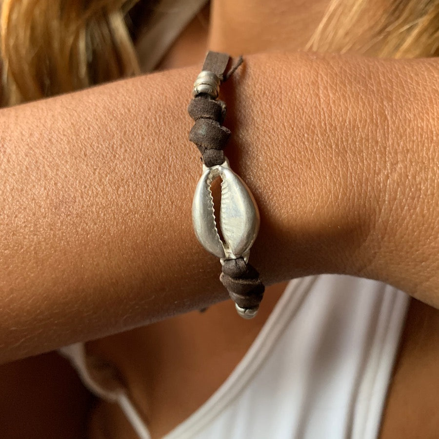 silver cowrie shell charm bracelet on suede leather